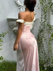 FJØRNA Coquette Princess satin maxi dress displayed on a hanger, featuring a flowing silhouette and elegant design.