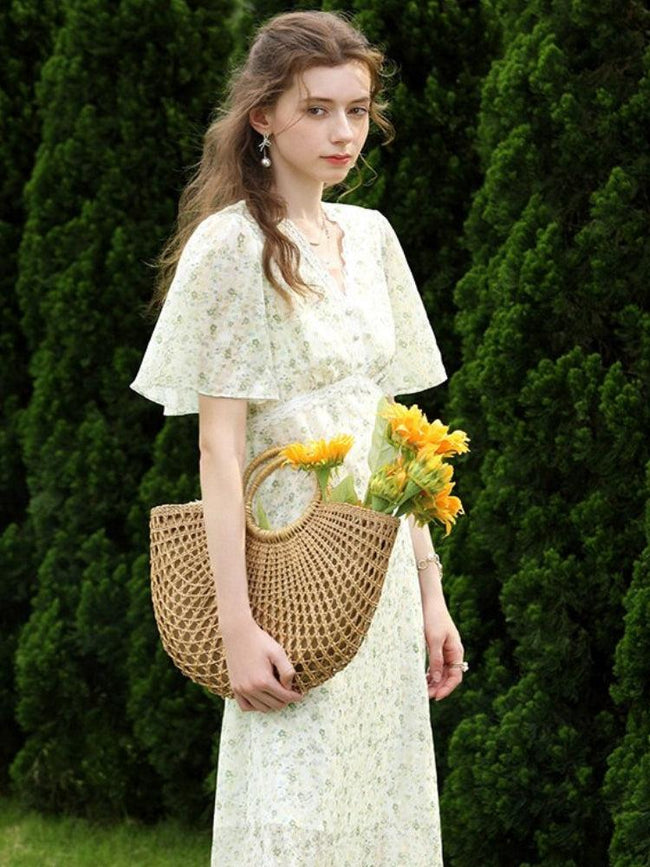 FJØRNA cottagecore floral midi dress in white with a flowing silhouette, perfect for romantic, vintage-inspired styles.