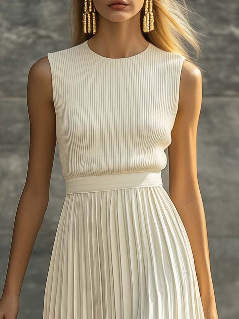 Cream chiffon pleated maxi dress by FJØRNA featuring flowing fabric and elegant pleats, perfect for casual occasions.