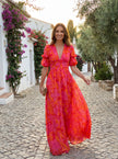 FJØRNA elegant women's maxi dress with v-neck design, flowing fabric, suitable for evening occasions, natural and stylish appearance.