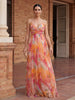Elegant floral V-neck maxi dress for women by FJØRNA, featuring a flowing silhouette and intricate floral pattern.