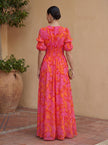 Back view of FJØRNA elegant women’s maxi dress with V-neck, flowing fabric, and sophisticated design for evening wear.