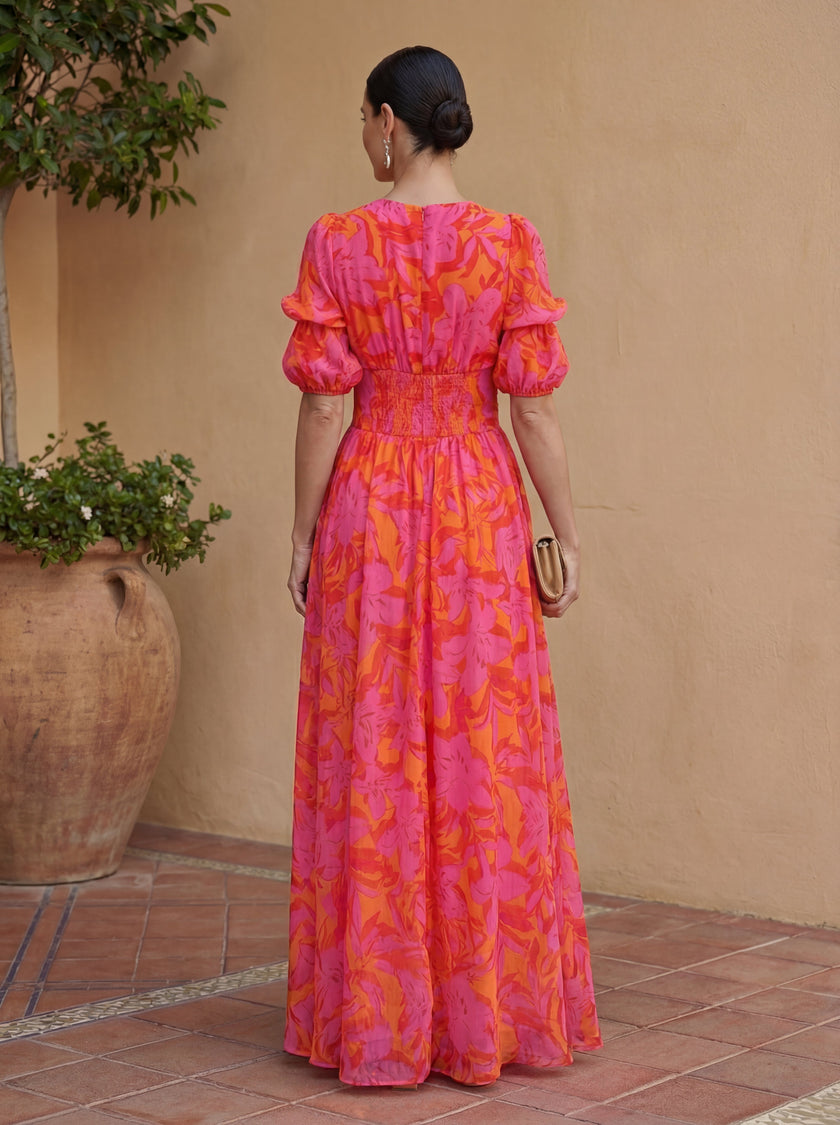 Back view of FJØRNA elegant women’s maxi dress with V-neck, flowing fabric, and sophisticated design for evening wear.