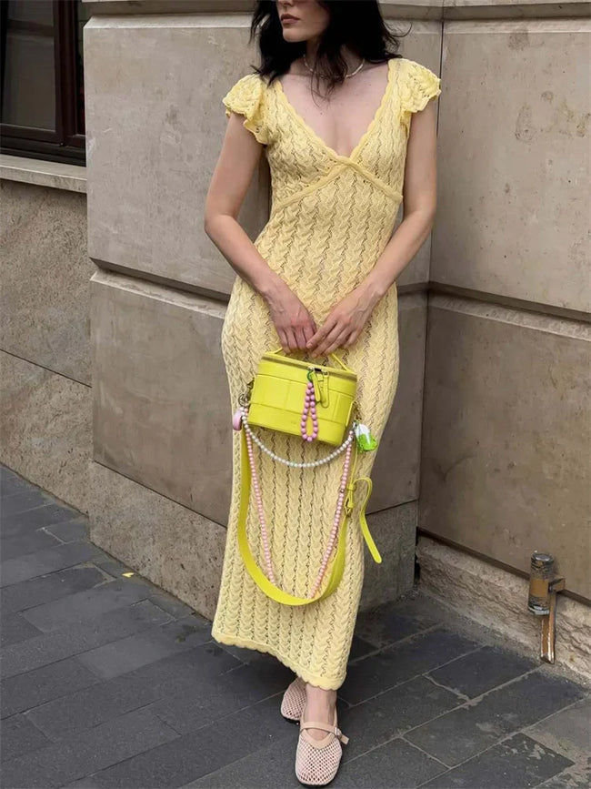 FJØRNA crochet women's midi dress with intricate knit pattern, perfect for day to night wear, shown on a model.