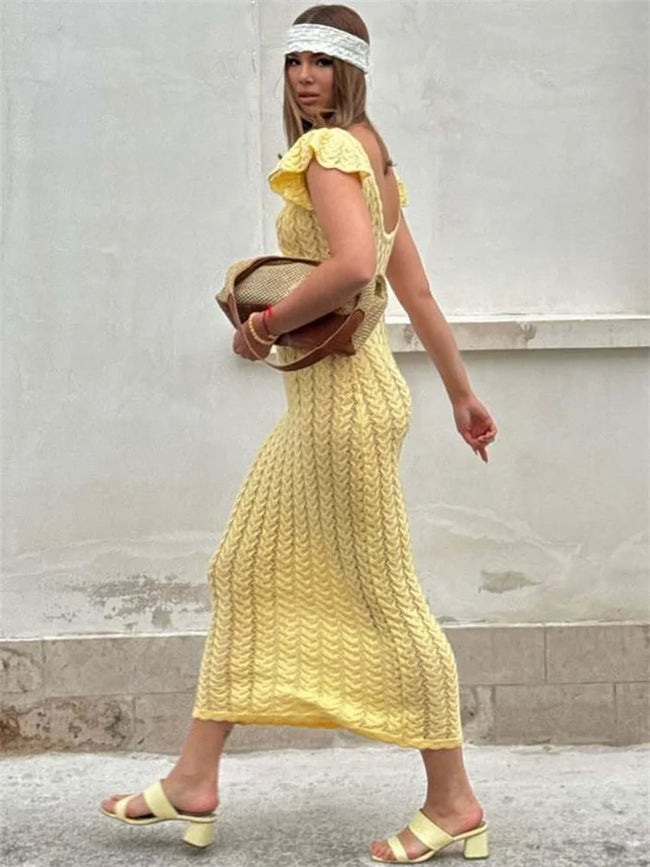 Crochet women's midi dress by FJØRNA featuring a stylish, flowy design ideal for day to night wear.