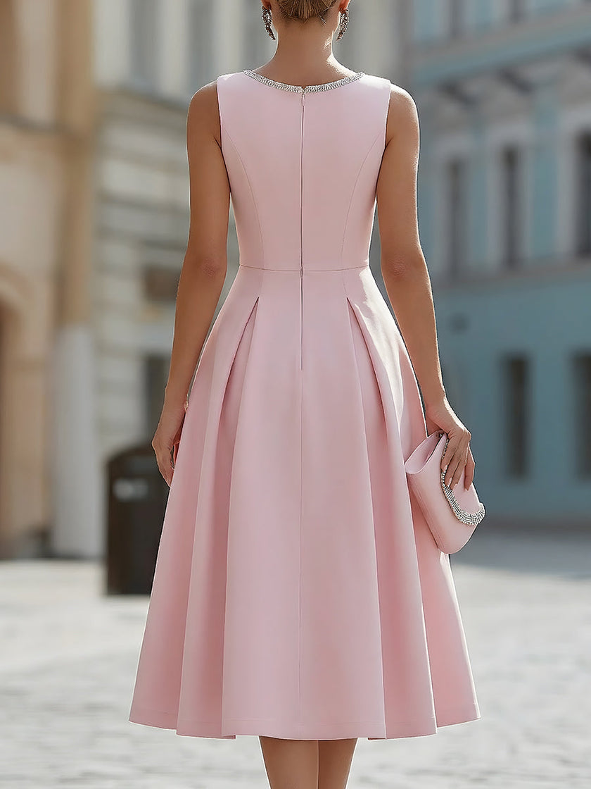 Elegant FJØRNA sleeveless fit and flare midi dress with rhinestone neckline, perfect for cocktail occasions.