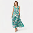 Women's sleeveless floral print tie neck boho maxi dress by FJØRNA, featuring a flowy silhouette and vibrant floral pattern.