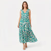 Women's sleeveless floral print tie neck boho maxi dress by FJØRNA, featuring a flowy silhouette and vibrant floral pattern.