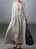 Light-colored loose V-neck cotton and linen dress by FJØRNA, casual wedding dress with flowing fabric and relaxed fit.