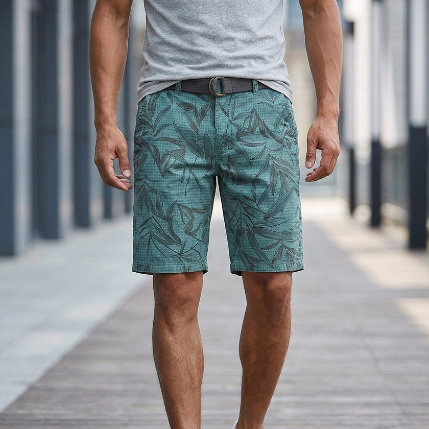 Dark blue men's casual work shorts with leaf print and belt, FJØRNA brand, featuring a relaxed fit and stylish design.