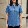Dark blue FJØRNA women's summer denim top with button front, stylish and casual for warm weather.