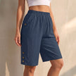 Dark blue women's summer shorts by FJØRNA with high waist, linen fabric, side pockets, lightweight for warm weather.