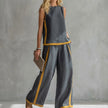 Dark gray women's summer two-piece co-ord set with a slit design from FJØRNA, stylish and comfortable for warm weather.