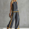 Dark gray women's summer two-piece co-ord set with a slit design from FJØRNA, stylish and comfortable for warm weather.