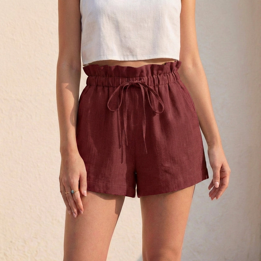 Dark red linen summer shorts for women with ruffle detail from FJØRNA, stylish and lightweight for warm weather.