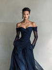Dark blue chiffon maxi dress by FJØRNA, elegant evening dress with flowing fabric and floor-length design.