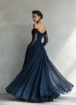 Dark blue chiffon maxi dress by FJØRNA featuring a flowing silhouette, elegant neckline, and long chiffon fabric for evening occasions.