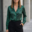 Dark green FJØRNA summer blouse for women with long sleeves and printed design, stylish and lightweight top for warm weather.
