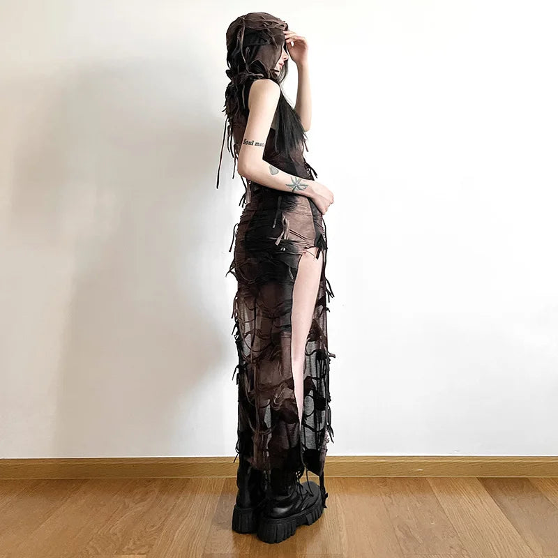 FJØRNA distressed sheer maxi dress featuring a flowing silhouette, lightweight fabric, and stylish distressed details.