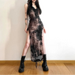 FJØRNA distressed sheer maxi dress featuring a flowing, semi-transparent fabric with a relaxed, bohemian style.