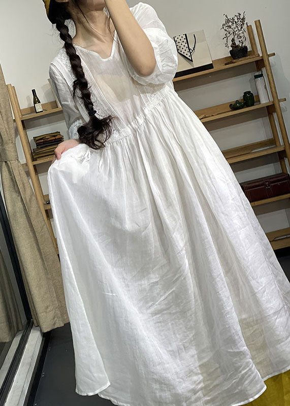 Purple lace patchwork cotton dress with V-neck, lantern sleeves, and cinched waist, perfect for casual or wedding attire by FJØRNA.
