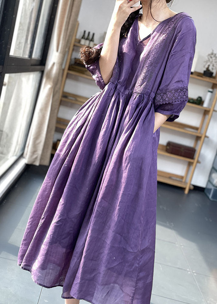 Purple FJØRNA cotton dress with lace patchwork, V-neck, lantern sleeves, and cinched waist, perfect for casual or wedding occasions.