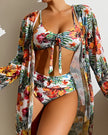 Women's floral bikini swimwear set with ruffled top and matching bottoms, featuring vibrant flower print and three-piece design.