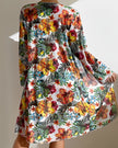 Women's three-piece floral bikini set with ruffles from FJØRNA, featuring a colorful floral pattern and stylish swimwear design.
