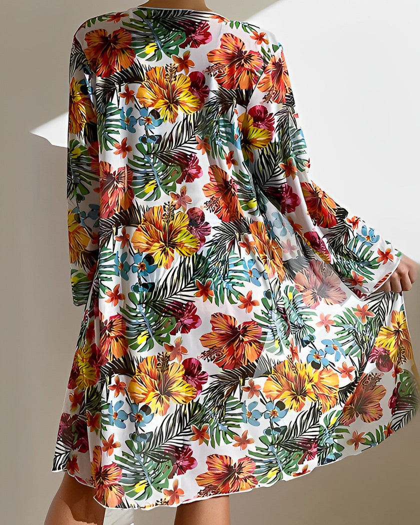 Women's three-piece floral bikini set with ruffles from FJØRNA, featuring a colorful floral pattern and stylish swimwear design.