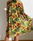 Women's floral bikini set with ruffles, three-piece swimwear by FJØRNA featuring colorful flower print and ruffled details.