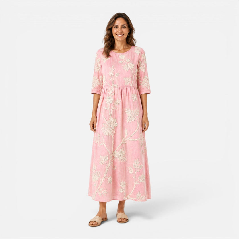 Lightweight women's summer floral midi dress by FJØRNA with bohemian-inspired floral print and flowing silhouette.