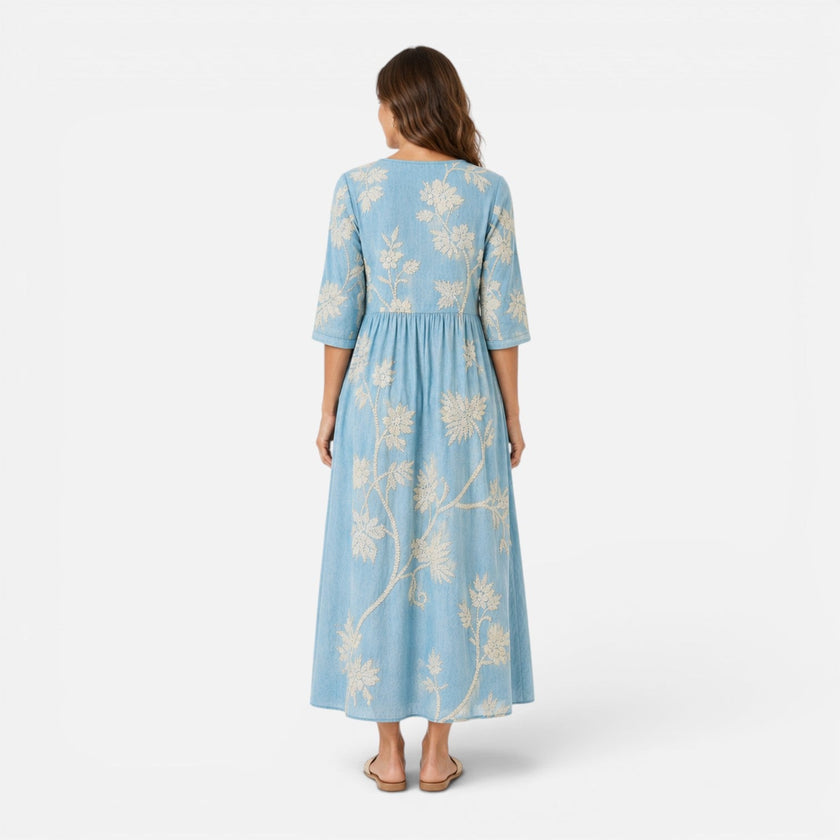 Lightweight women's summer floral midi dress by FJØRNA featuring a bohemian design and flowing fabric.