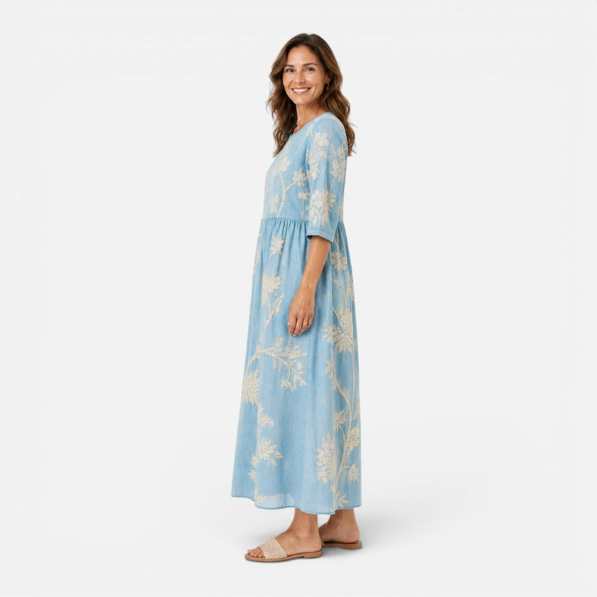 Women's lightweight floral midi dress by FJØRNA featuring bohemian-inspired design and breezy summer fabric.