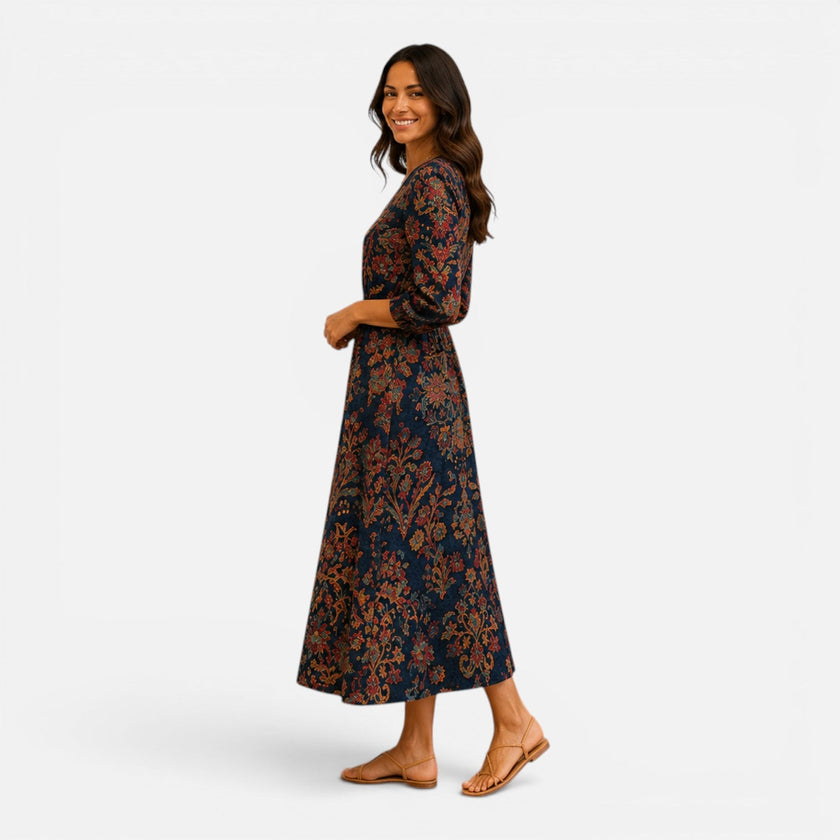Women's lightweight floral midi dress by FJØRNA featuring bohemian-inspired design and flowing fabric.