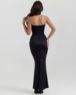 Women's strapless velvet corset maxi dress with ruched detail by FJØRNA, featuring a fitted bodice and flowing skirt.