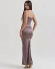 Velvet women's strapless corset maxi dress with ruched detail by FJØRNA, featuring a fitted bodice and flowing skirt.