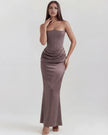 Women's strapless velvet corset maxi dress with ruched detail by FJØRNA, featuring a fitted bodice and flowing skirt.