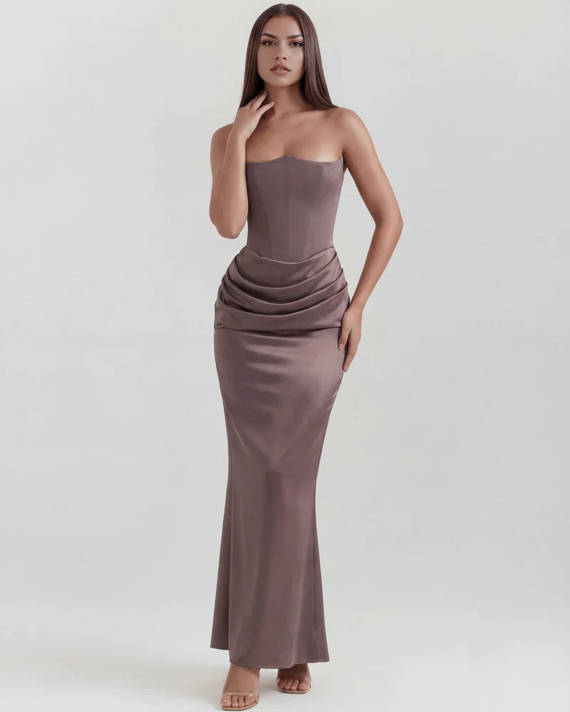 Women's strapless velvet corset maxi dress with ruched detail by FJØRNA, featuring a fitted bodice and flowing skirt.