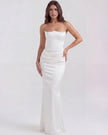 Velvet women's strapless corset maxi dress with ruched detail by FJØRNA, showcasing a fitted bodice and flowing skirt.