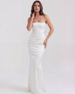 FJØRNA women's strapless velvet corset maxi dress with ruched detail, featuring a fitted bodice and flowing skirt.