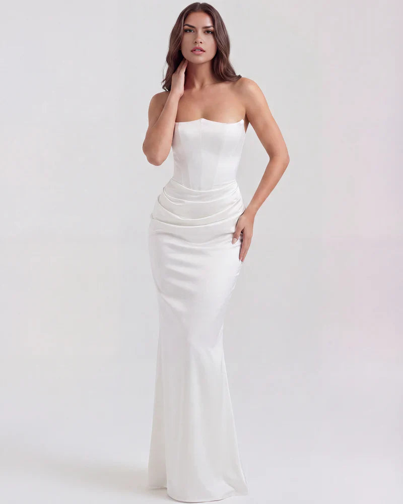 FJØRNA women's strapless velvet corset maxi dress with ruched detail, featuring a fitted bodice and flowing skirt.