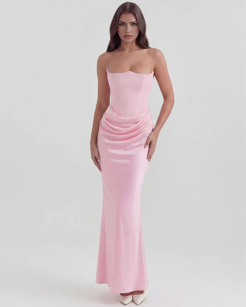 Velvet women's strapless corset maxi dress with ruched detail by FJØRNA, showing a fitted bodice and flowing skirt in the image.