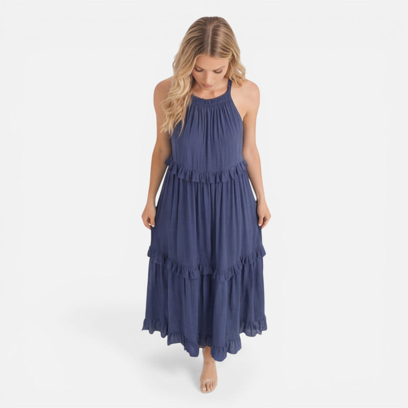 Lightweight, flowy women's tiered maxi dress by FJØRNA featuring a halter neck, perfect for summer wear.