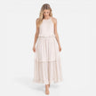 Lightweight women's tiered maxi dress by FJØRNA with a flowy design and halter neck, perfect for summer wear.