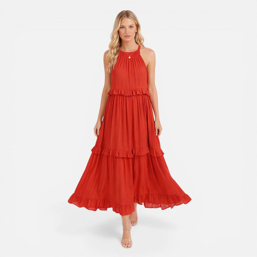 Lightweight women's tiered maxi dress by FJØRNA with a flowy silhouette and halter neck, ideal for summer wear.