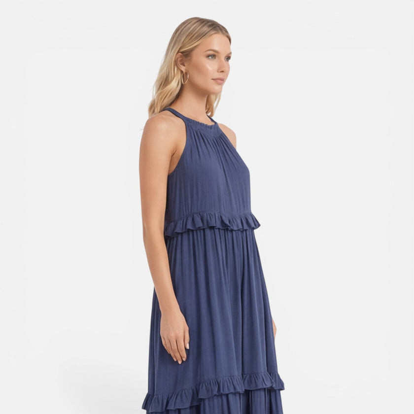 Lightweight women's tiered maxi dress by FJØRNA with a flowy design and halter neck, perfect for summer wear.