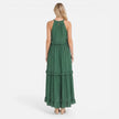 Lightweight, flowy women's tiered maxi dress with halter neck by FJØRNA, perfect for summer, shown on a model.