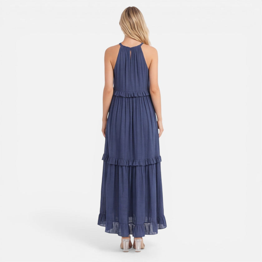 Lightweight women's tiered maxi dress by FJØRNA featuring a flowy design and halter neck, perfect for summer wear.