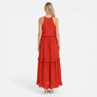 Lightweight women's tiered maxi dress by FJØRNA with a flowy summer design and halter neck, perfect for warm weather.
