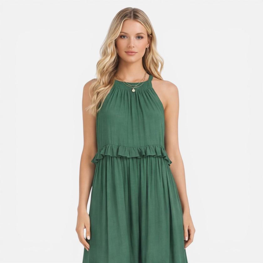 Lightweight women's tiered maxi dress by FJØRNA with a flowy silhouette and halter neck, perfect for summer wear.